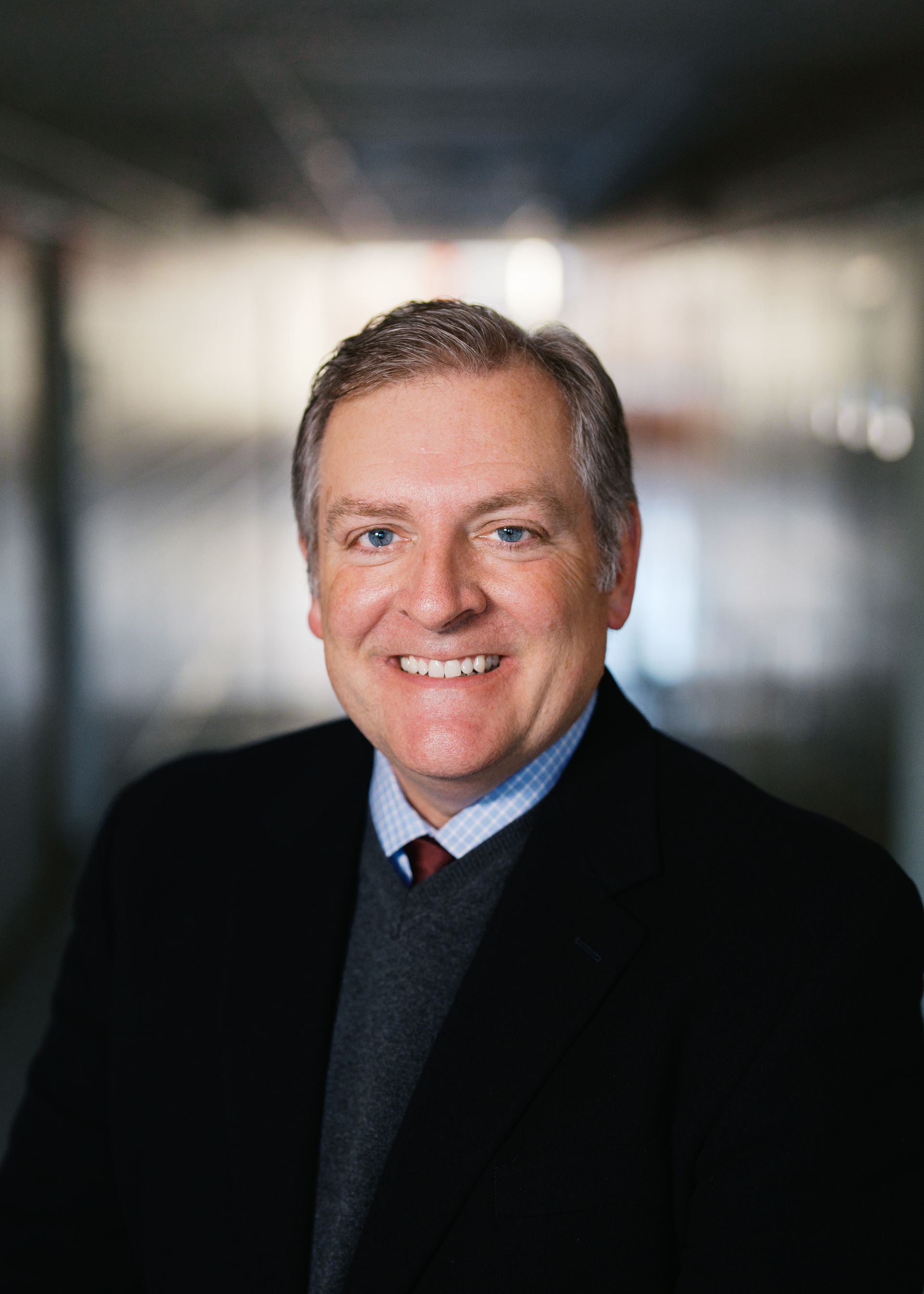 A silhouette of a person without a face on a white background.