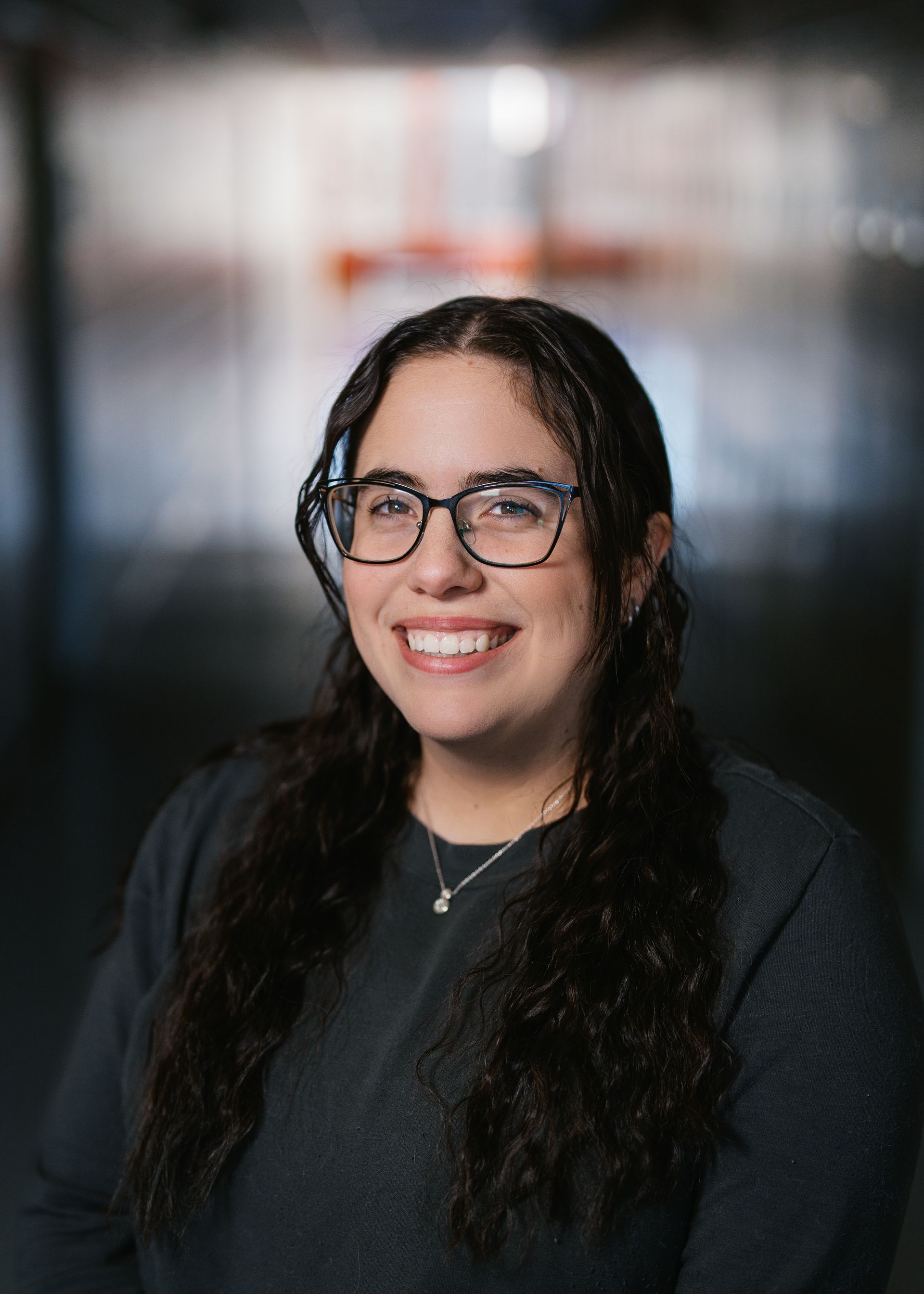 A silhouette of a person without a face on a white background.