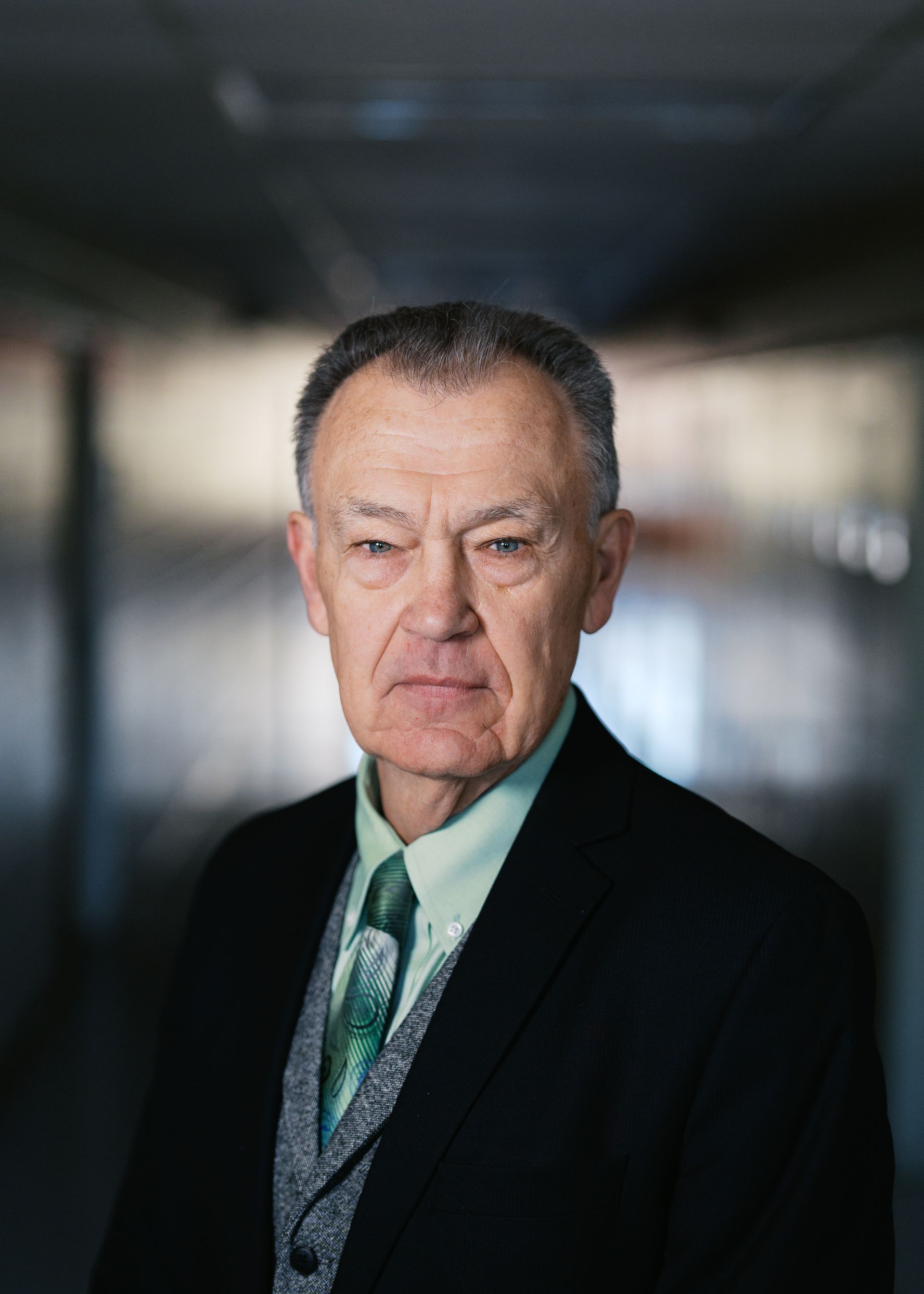 A silhouette of a person without a face on a white background.