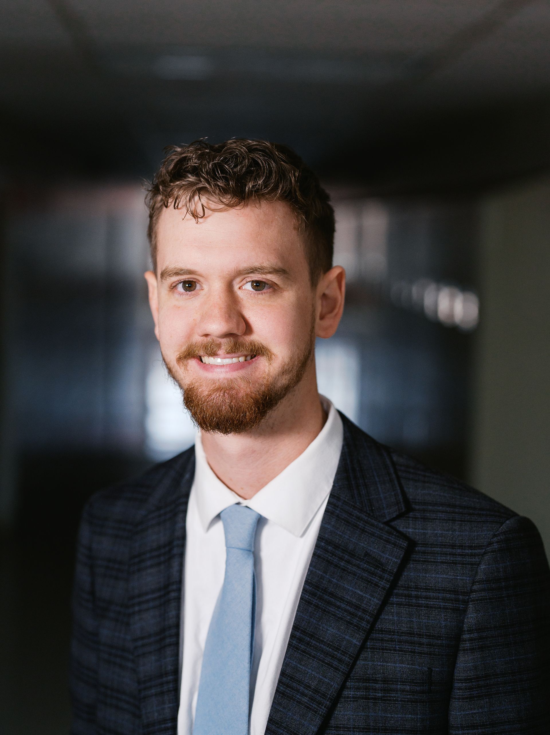 A silhouette of a person without a face on a white background.
