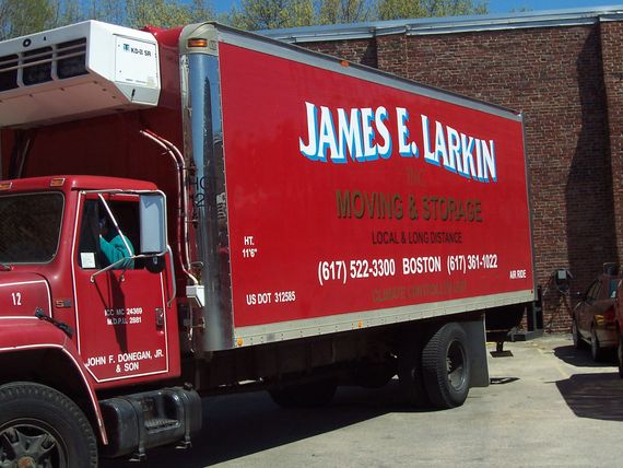 a red james e. larkin moving and storage truck