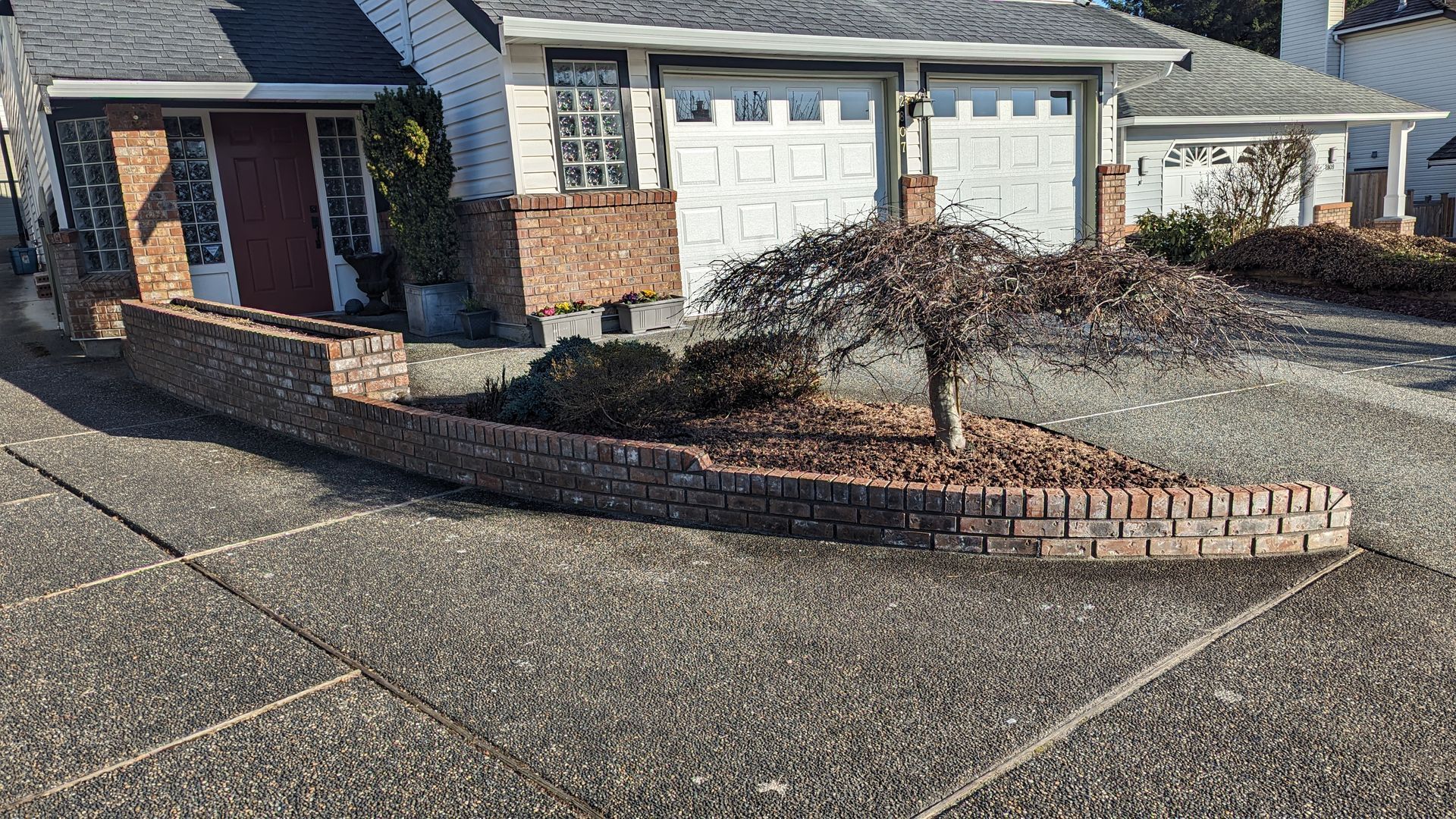 This is what the garden wall looked like AFTER we restored and repointed the bricks