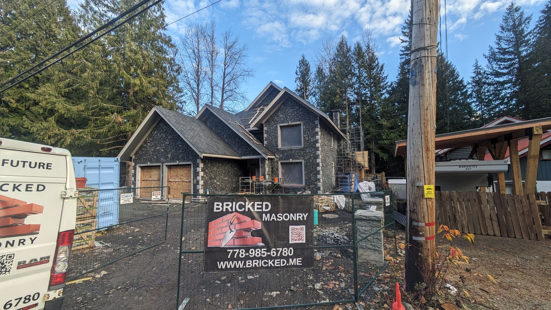 A house in Vancouver under construction with stone veneer installed by Bricked Masonry