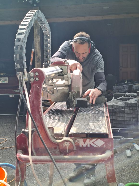 Chris the owner of Bricked Masonry is using a circular saw to cut bricks.