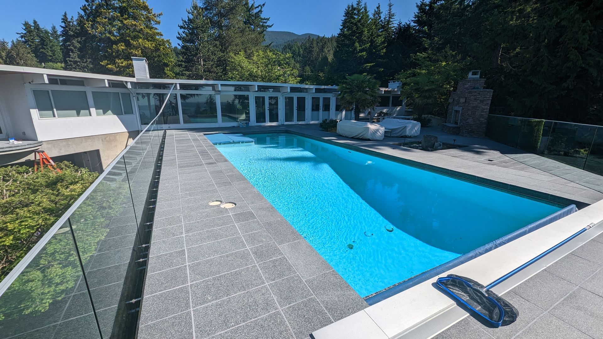 Granite tile flooring around a residential pool
