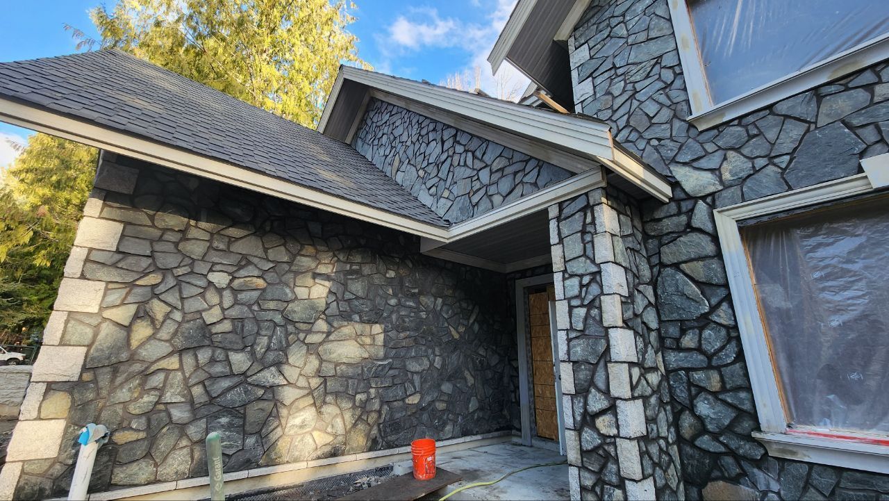 We repair and construct brick chimneys throughout Metro Vancouver! Natural stone siding freshly installed on a residential home in Vancouver BC by Chris at Bricked Masonry.