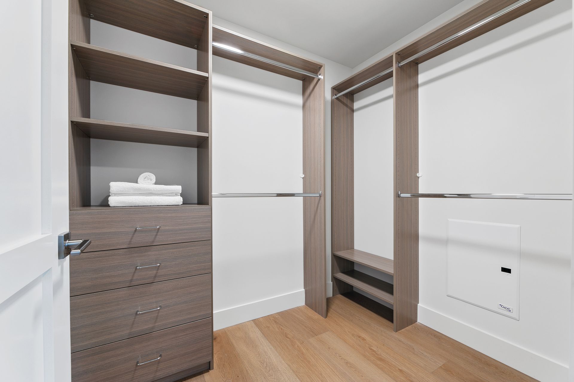 Photo of a very large walk-in closet, with plenty of natural lighting