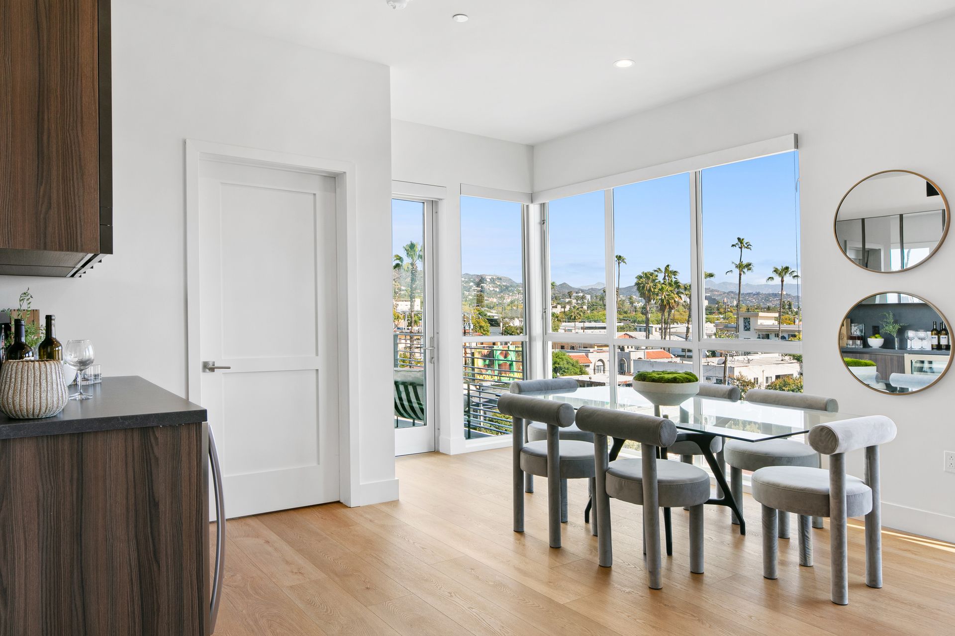 Photo of a living room dining area with plenty of natural lighting