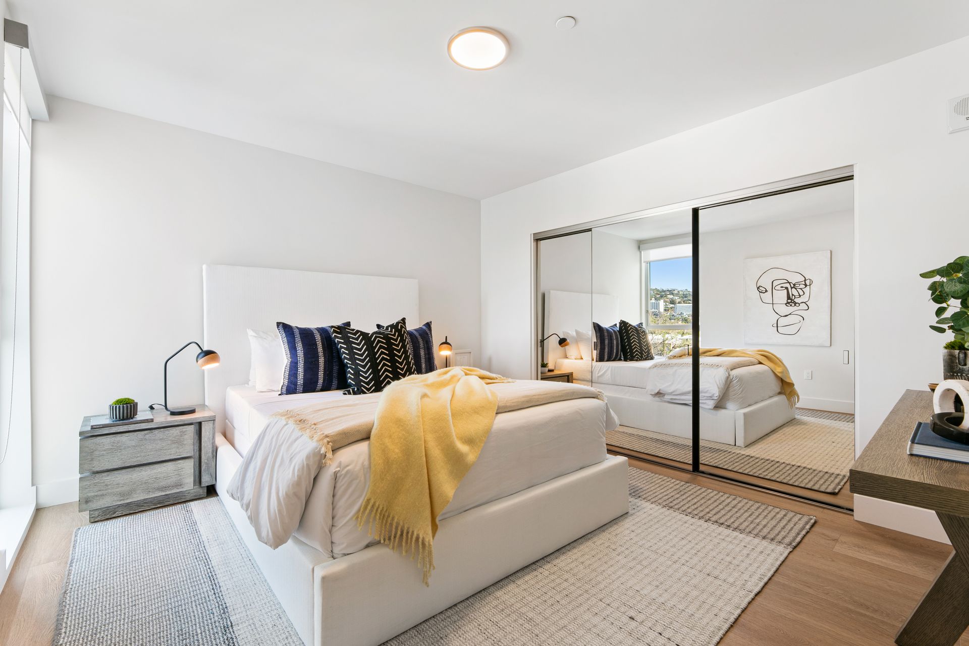 Photo of a bedroom with sliding closet doors