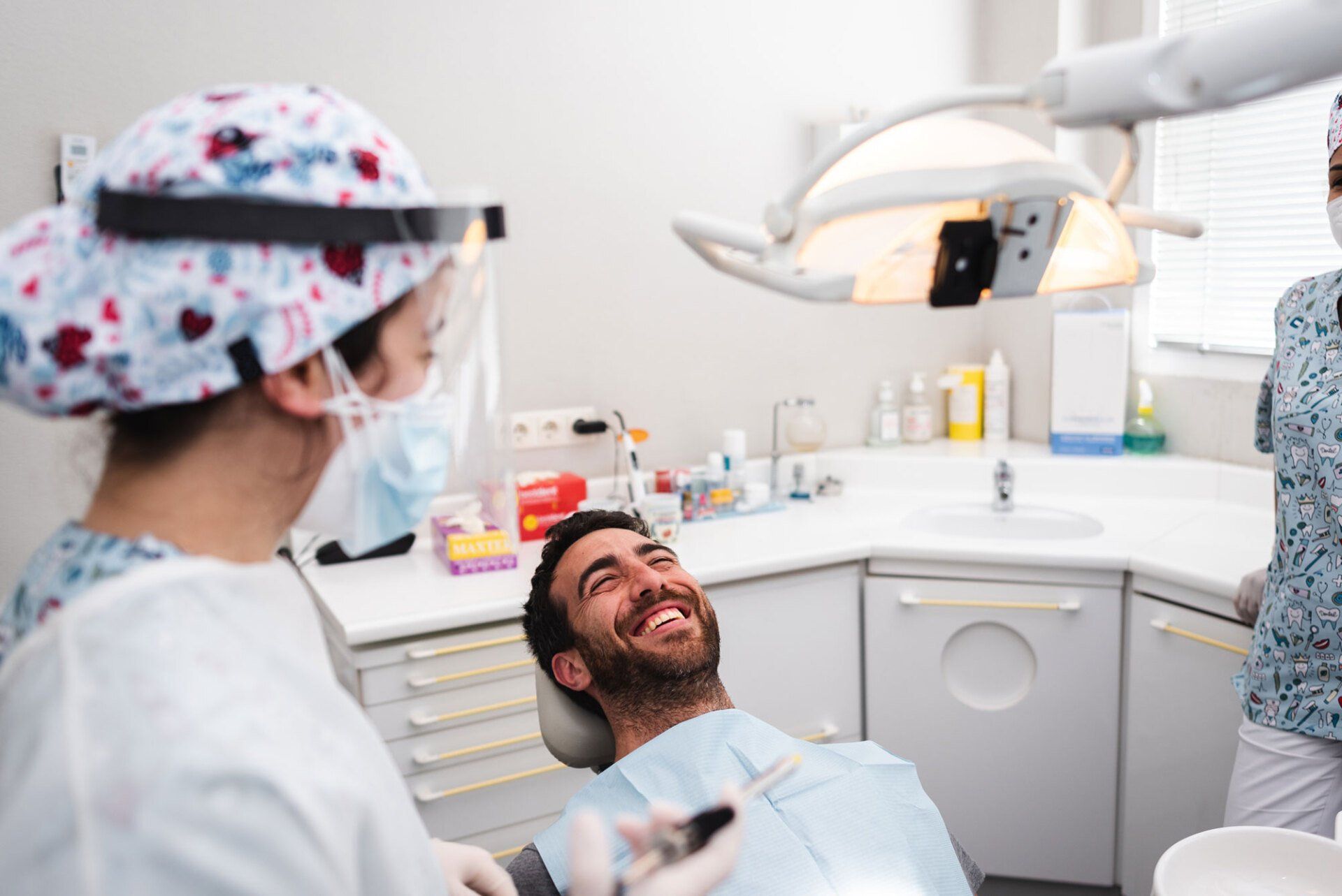 Dentist Talking to the Patient — Jackson Heights, NY — Vanguard and Achury Dental