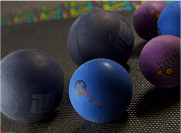 A bunch of different colored balls with one that says lupe on it