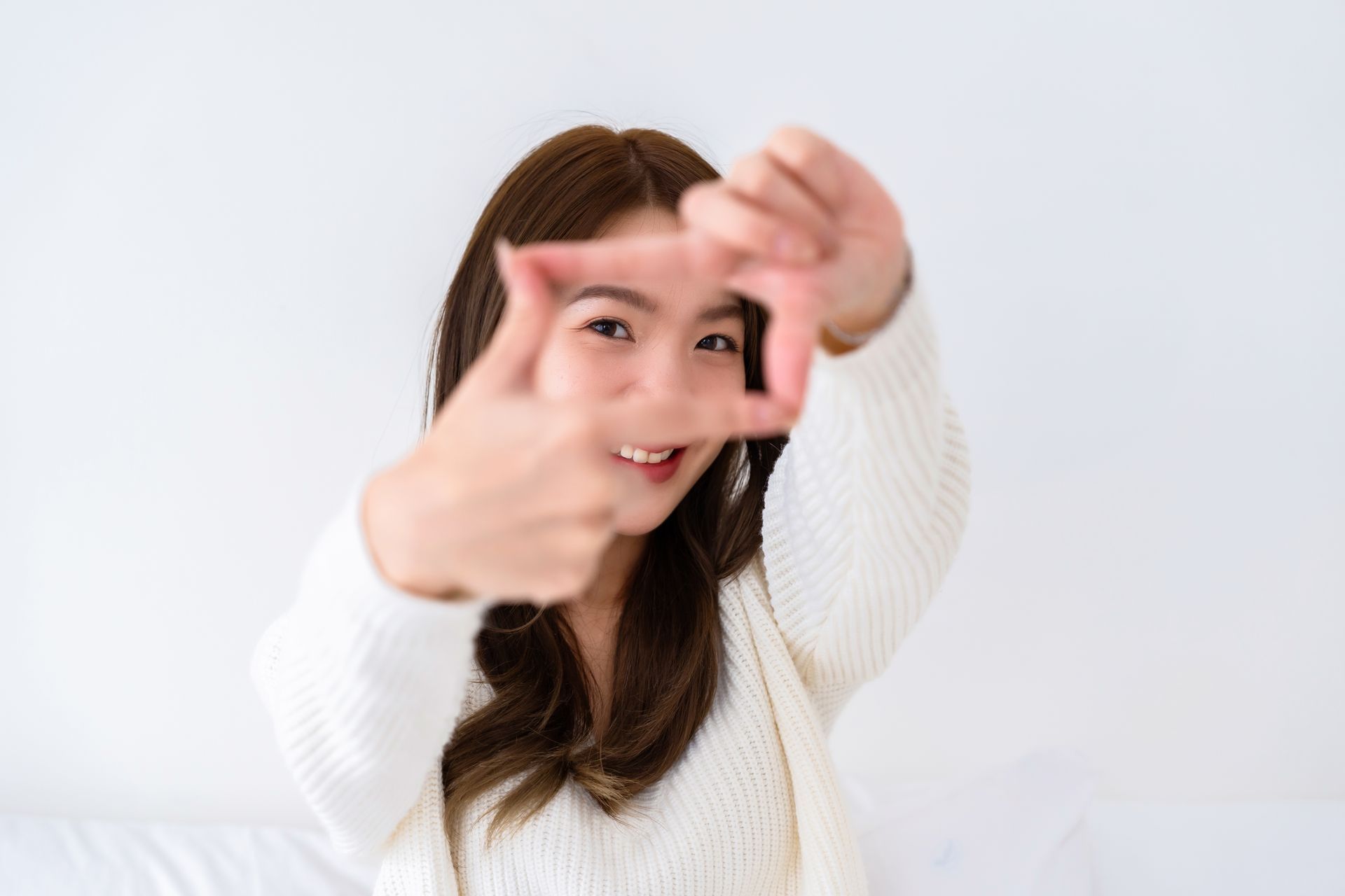 woman with frame around eyes smiling 