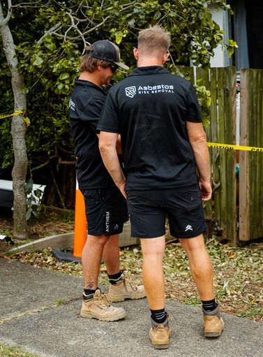 A Man In A Gas Mask Infront Of A Yellow Seal  — Asbestos Risk Removal In Rockhampton, QLD