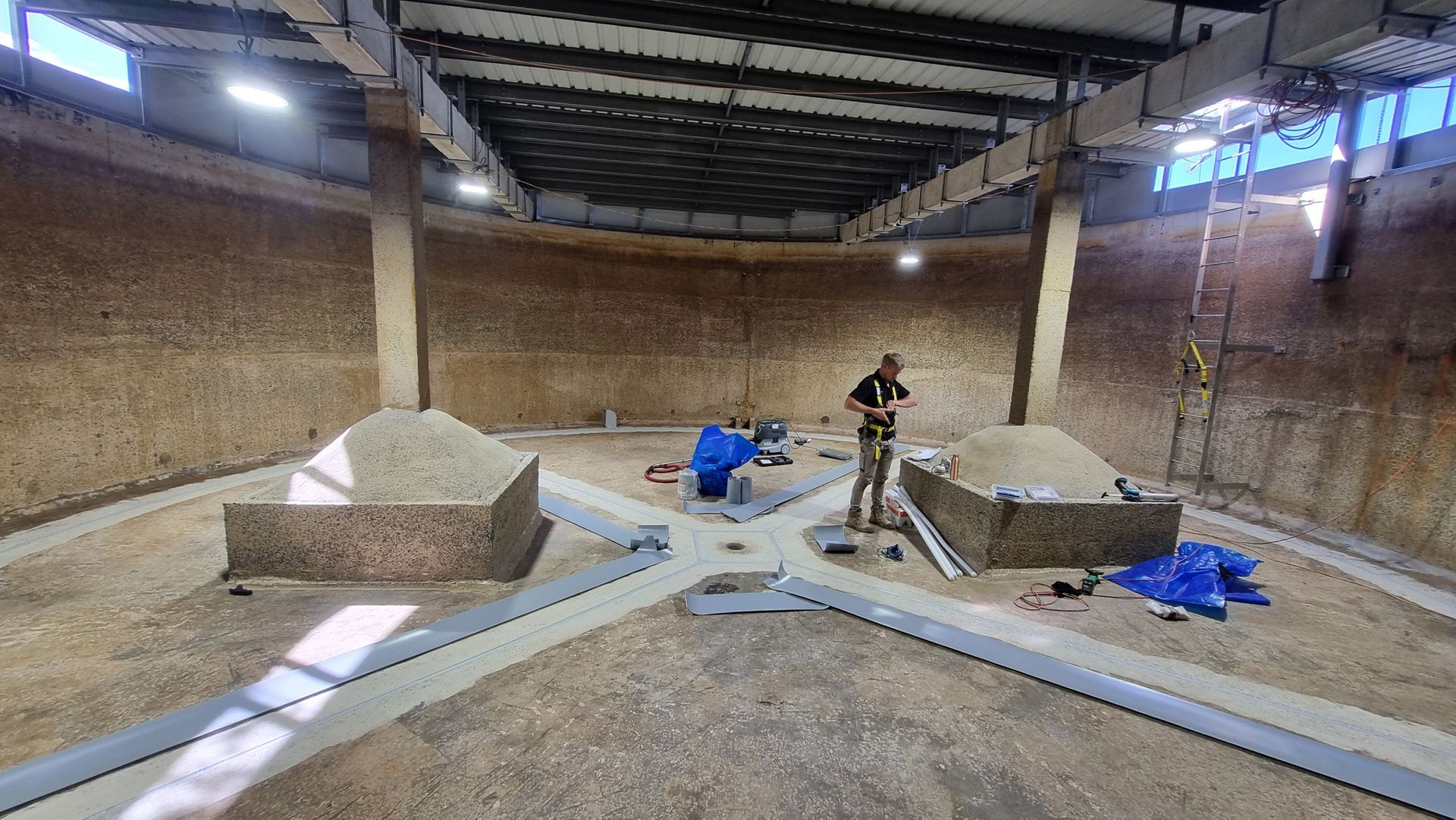 A Pile of Plastic Bags Sitting on Top of Wooden Pallets — Asbestos Risk Removal In Rockhampton, QLD
