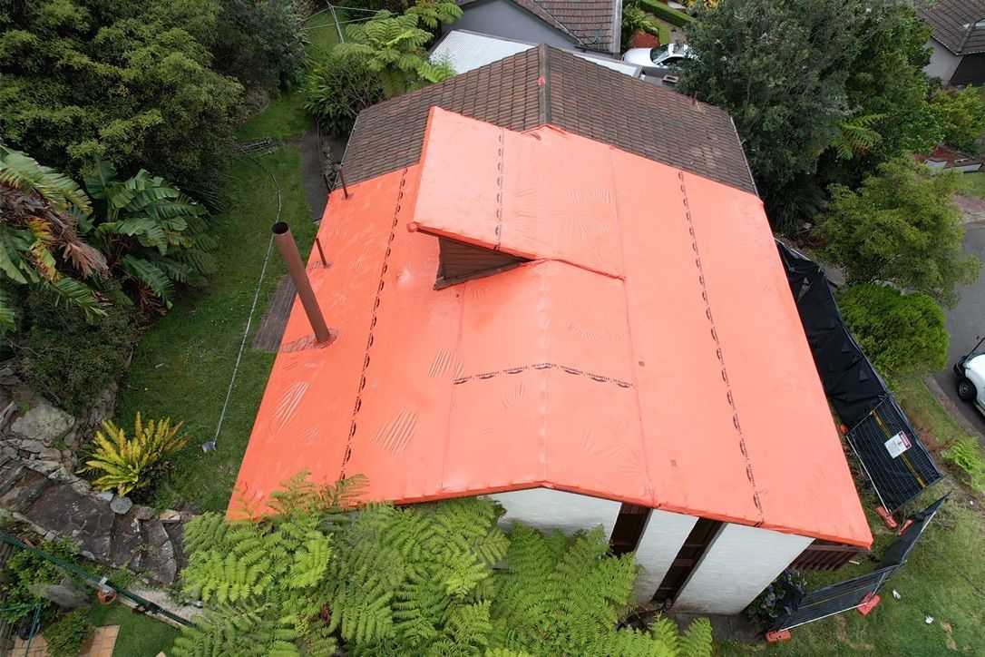 A Roof with An Red Seal — Asbestos Risk Removal In Rockhampton, QLD