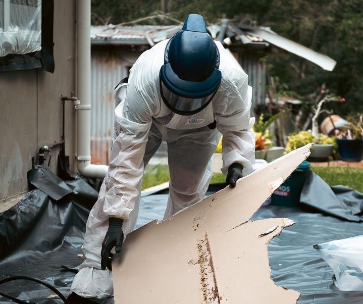 Two Men Working On Removing Asbestos On A Roof — Asbestos Risk Removal In Rockhampton, QLD