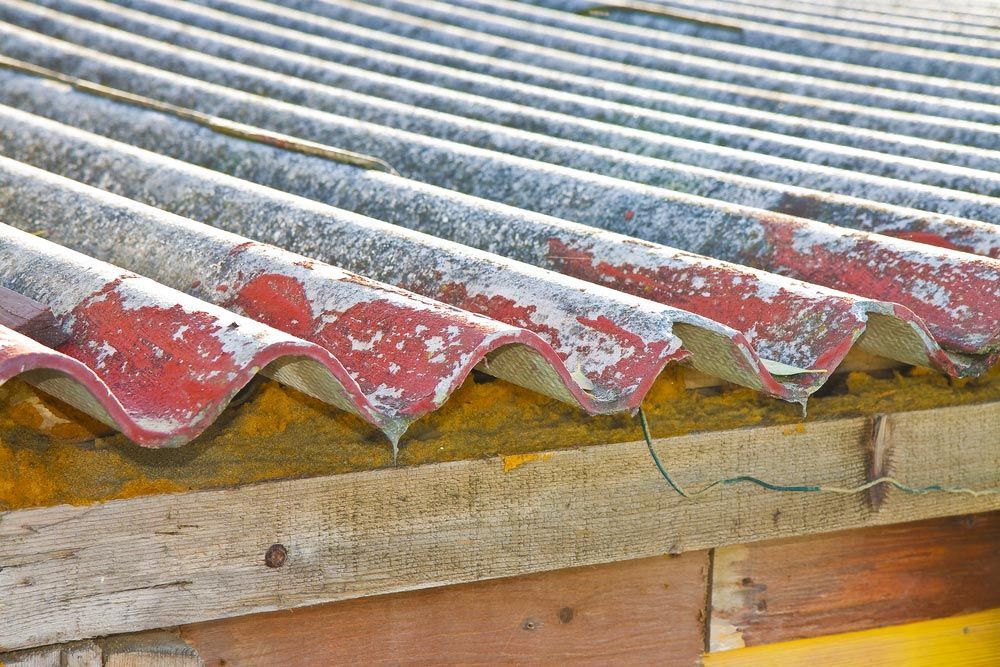 A Close Up Of a Roof with Asbestos on It — Asbestos Risk Removal In Gladstone, QLD
