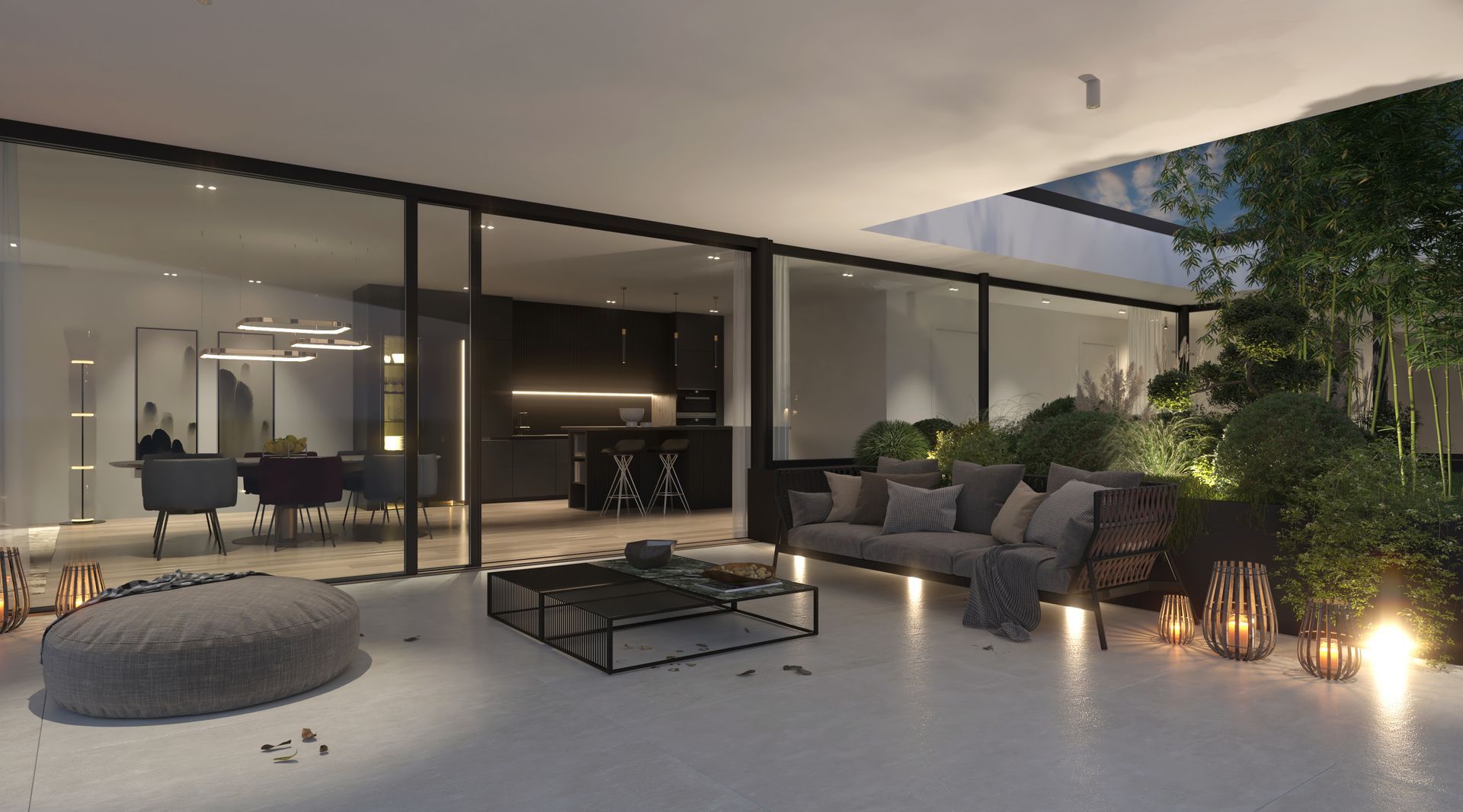 Terrazza coperta con un divano e un tavolo, grande vetrata e piante sullo sfondo