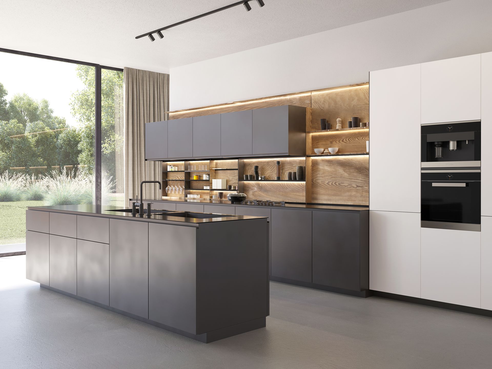 Cuisine moderne grise et blanche avec îlot, électroménagers intégrés et grande fenêtre donnant sur la verdure.
