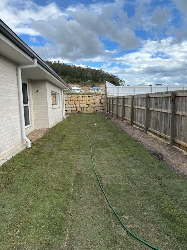 Side Yard With New Grass — Coastline Earthworks in Helensvale, QLD