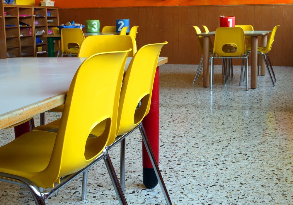 Bright, Modern Classroom With Small Yellow Plastic Chairs — Cyclone City Cleaners In Winnellie, NT