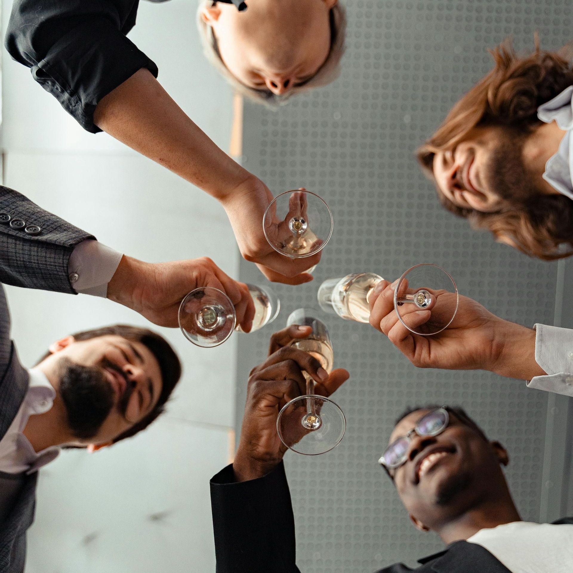 adults raising the glasses for a cheers