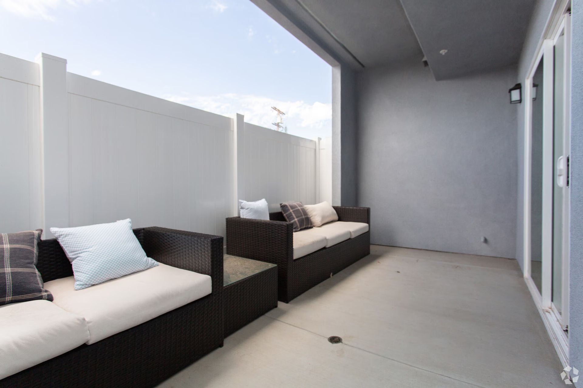 Photo showing a patio with two couches