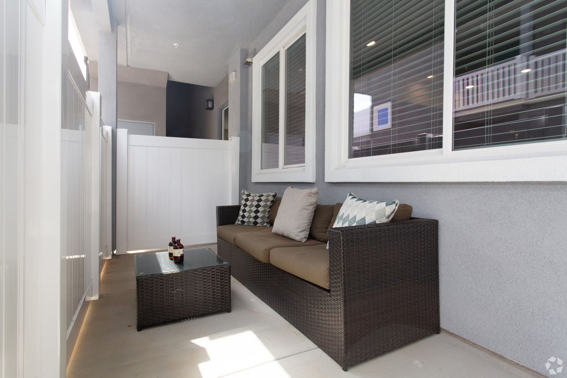 Photo showing a patio with a couch outside