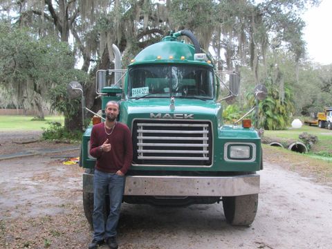 Septic Tank Pumping — Septic Pump Truck And A Man In A Maroon Shirt in Sarasota, FL