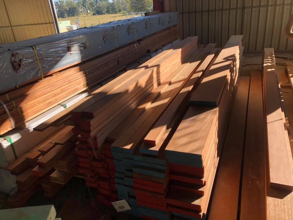 Stacks of  Lumber Inside a Warehouse — Premium Trusses In South Grafton, NSW