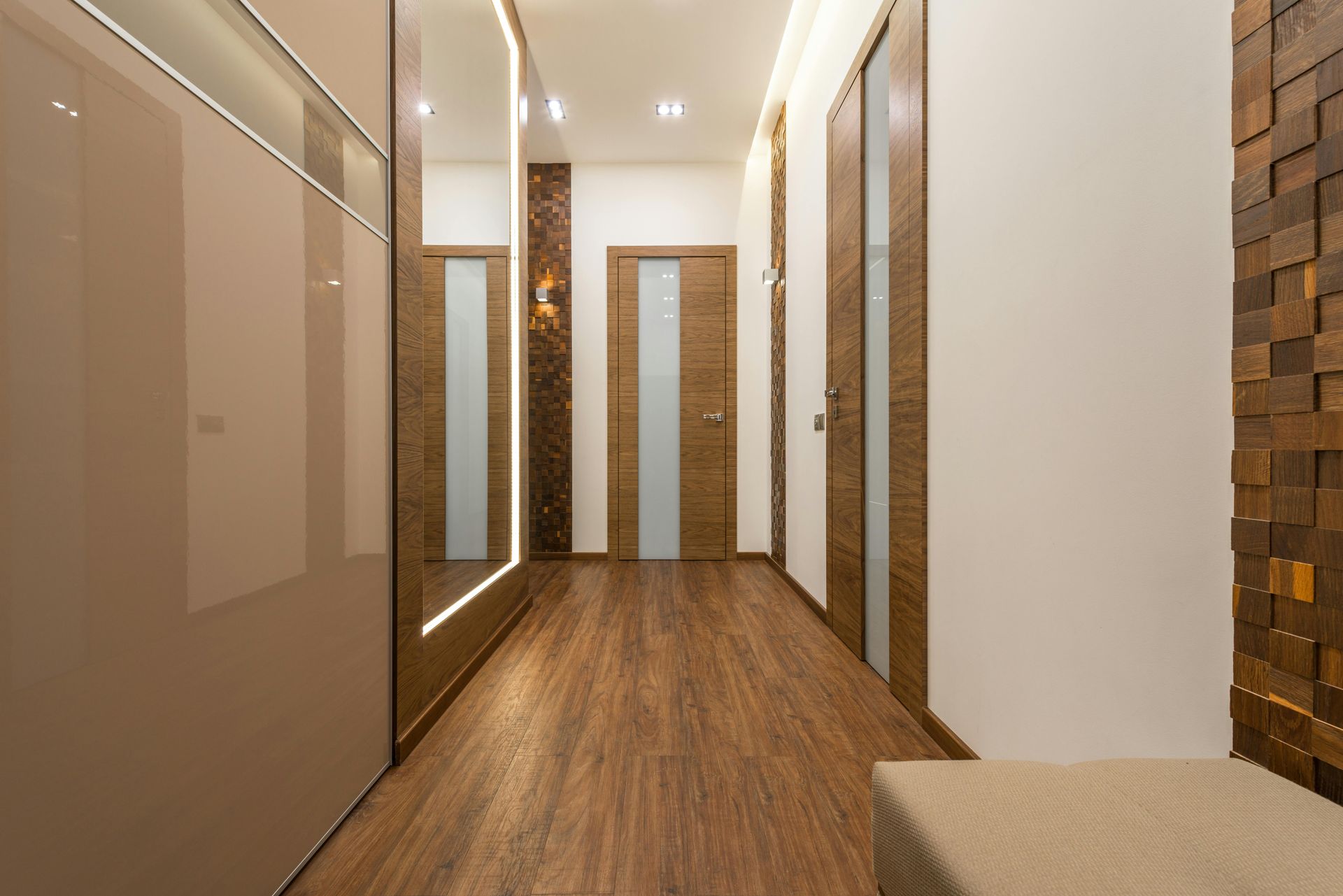 Hallway with wooden floors, doors, and accent wall — Premium Trusses In South Grafton, NSW