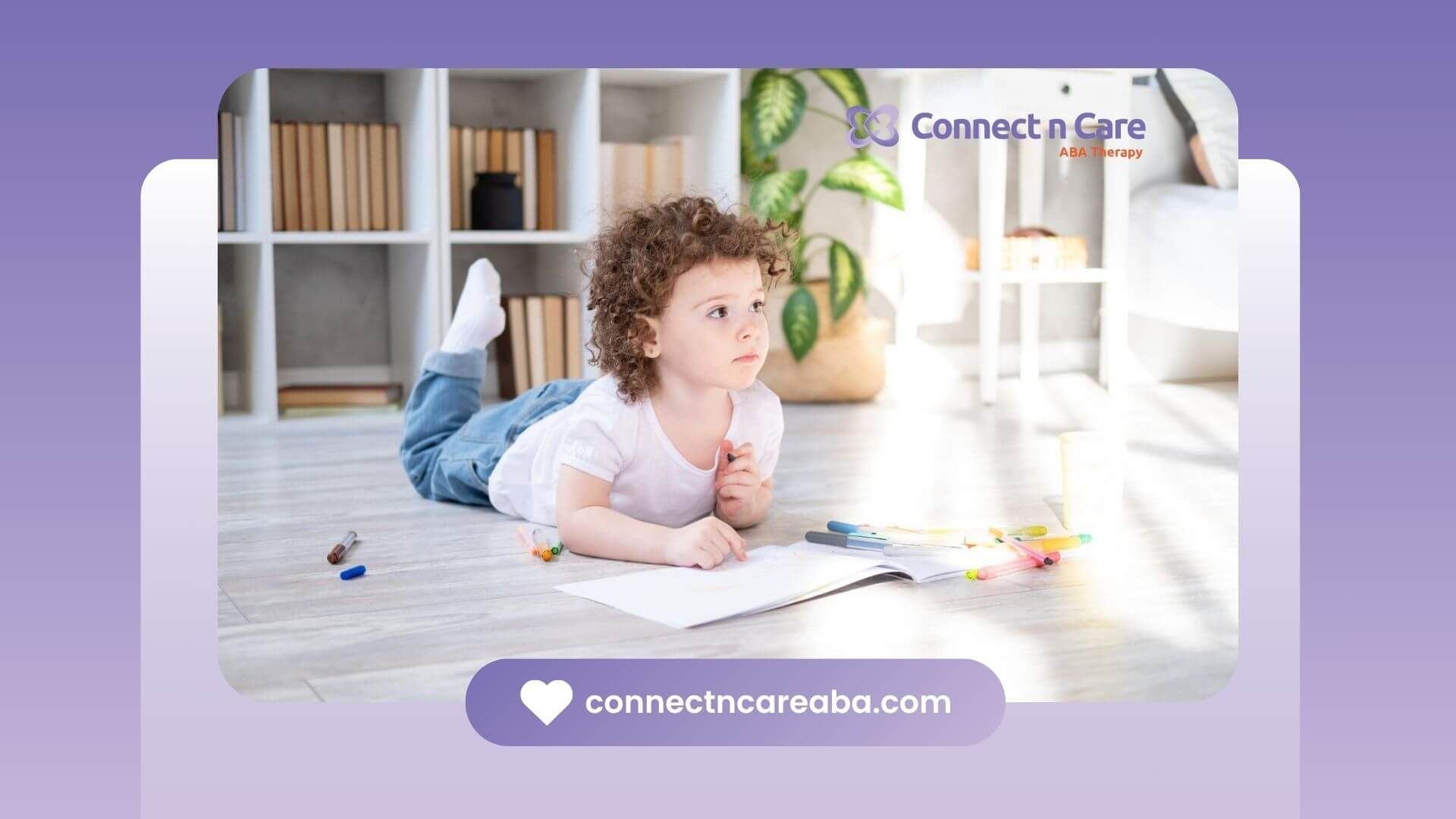 Child lying on the floor drawing with colorful markers in ABA therapy.