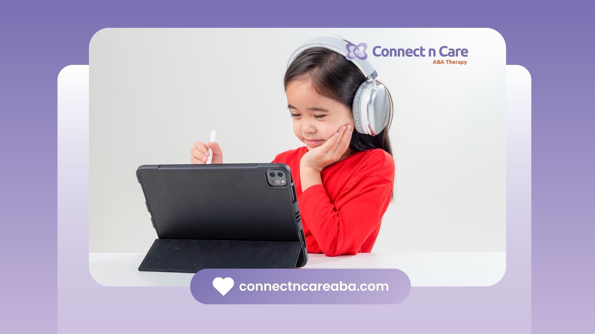 An autistic girl wearing headphones is using an iPad.