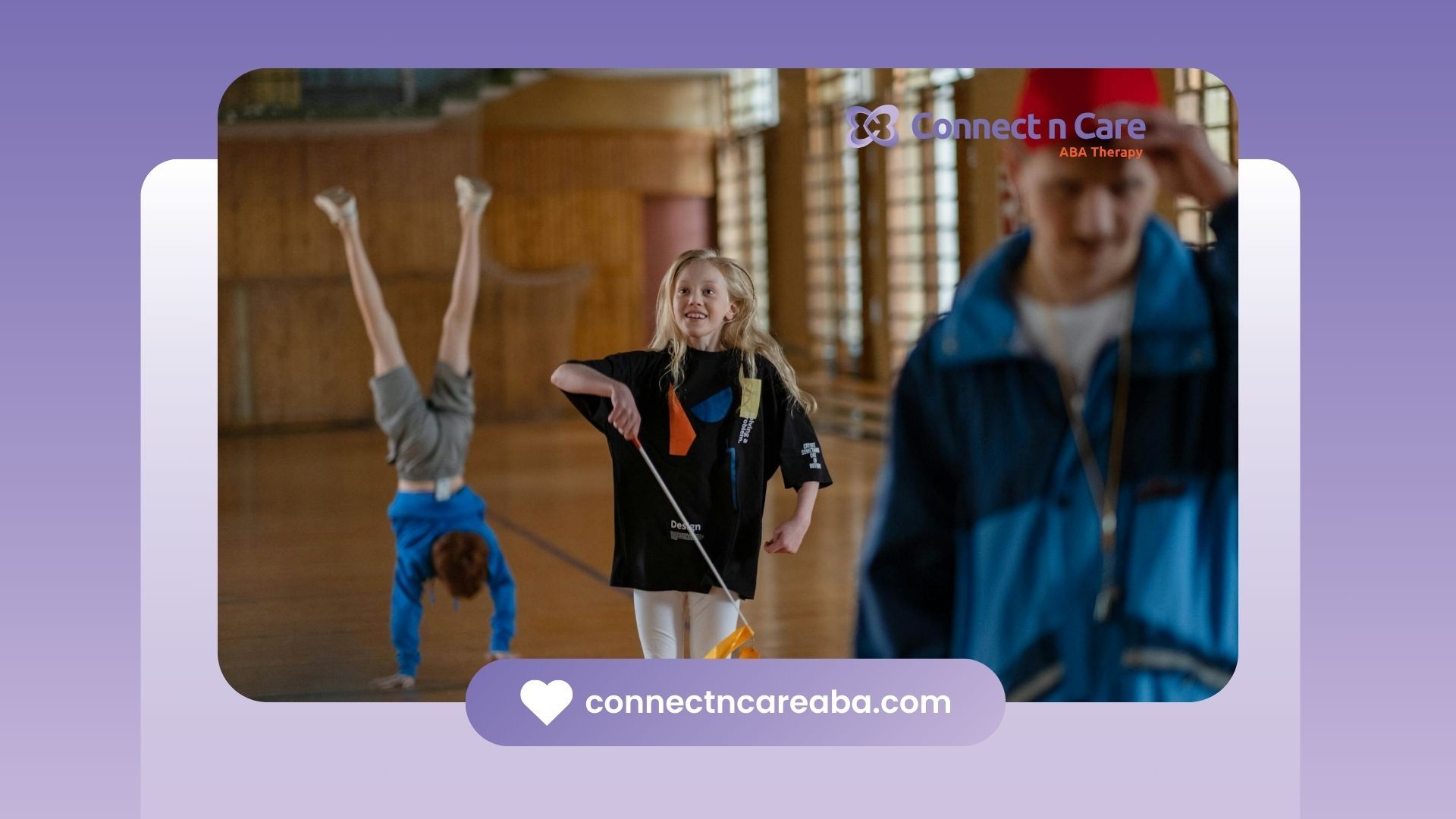 Girl with autism joyfully performing ribbon exercises with other autistic children at a gym in NC.