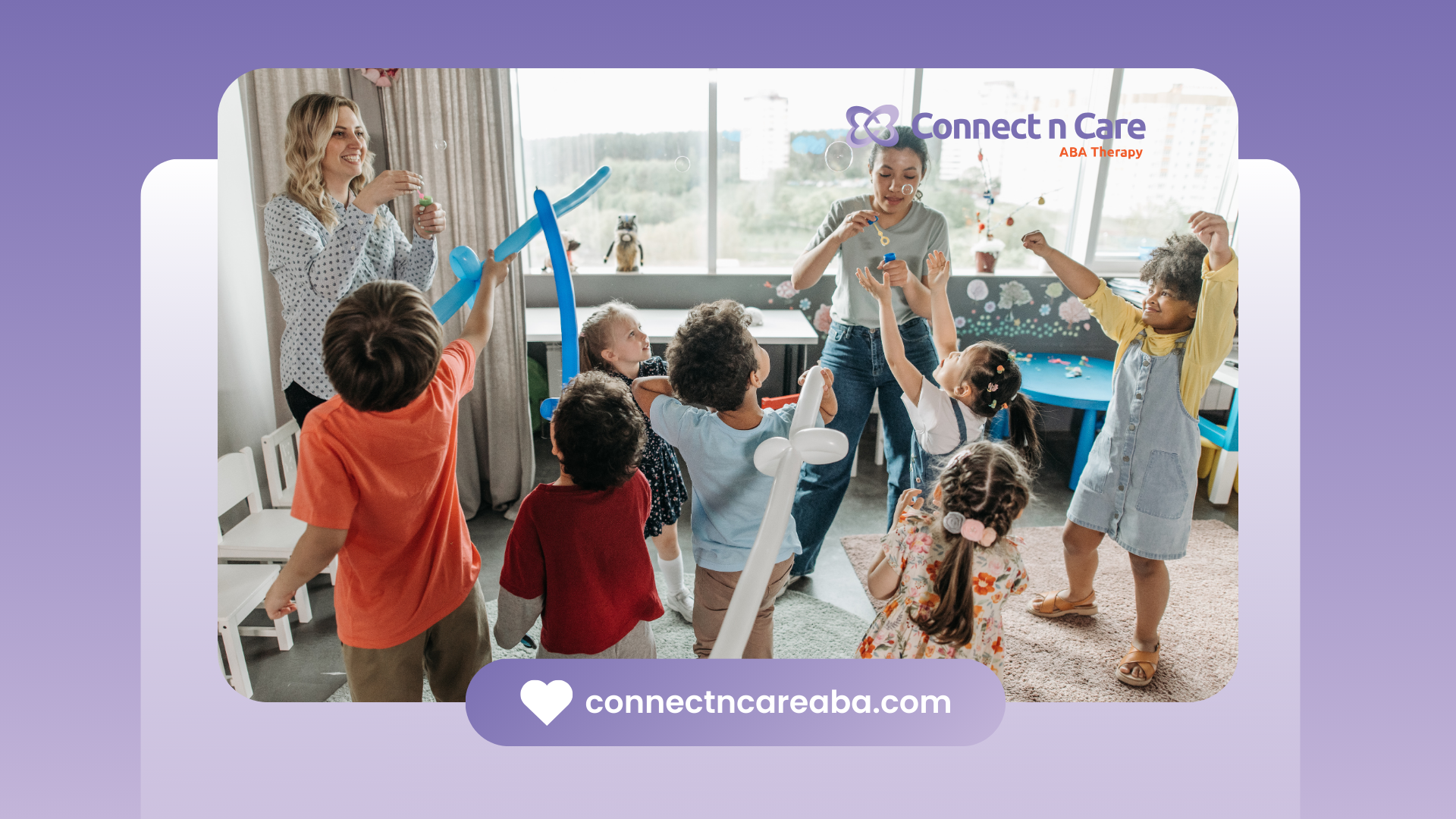 Children play with balloons in a classroom with adults.