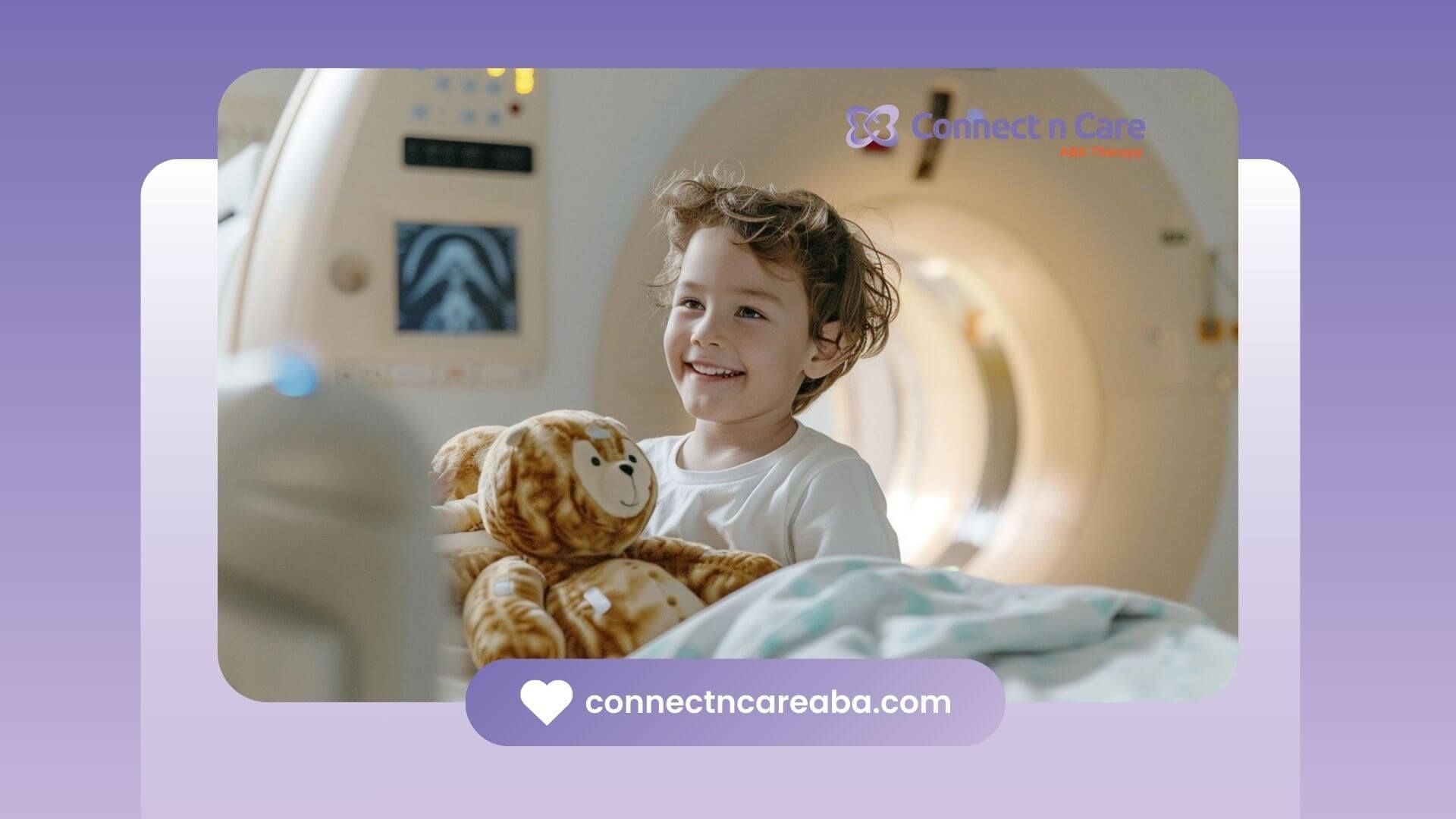 Smiling child with autism holding a stuffed animal while lying in a medical imaging scanner.