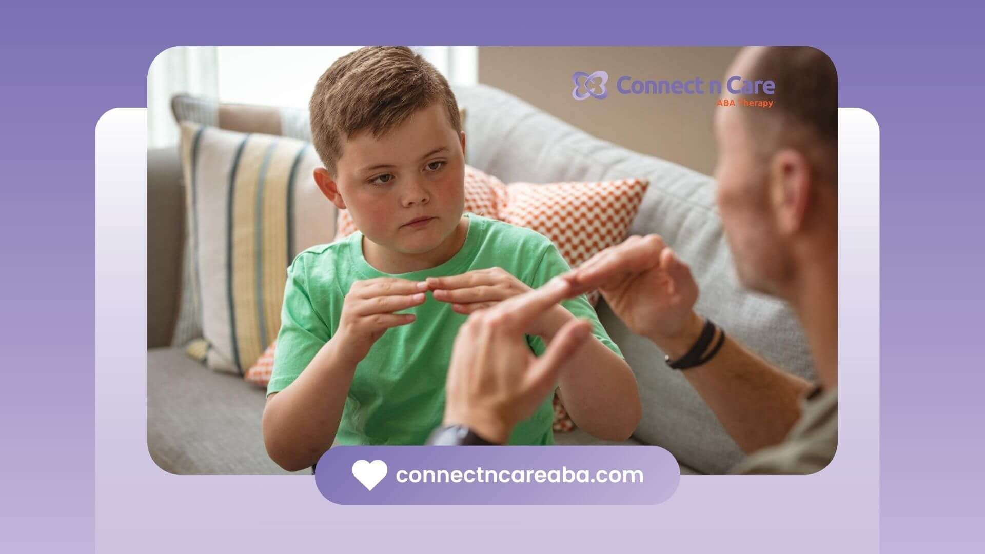 Boy with autism and ABA therapist using sign language while sitting on a couch.