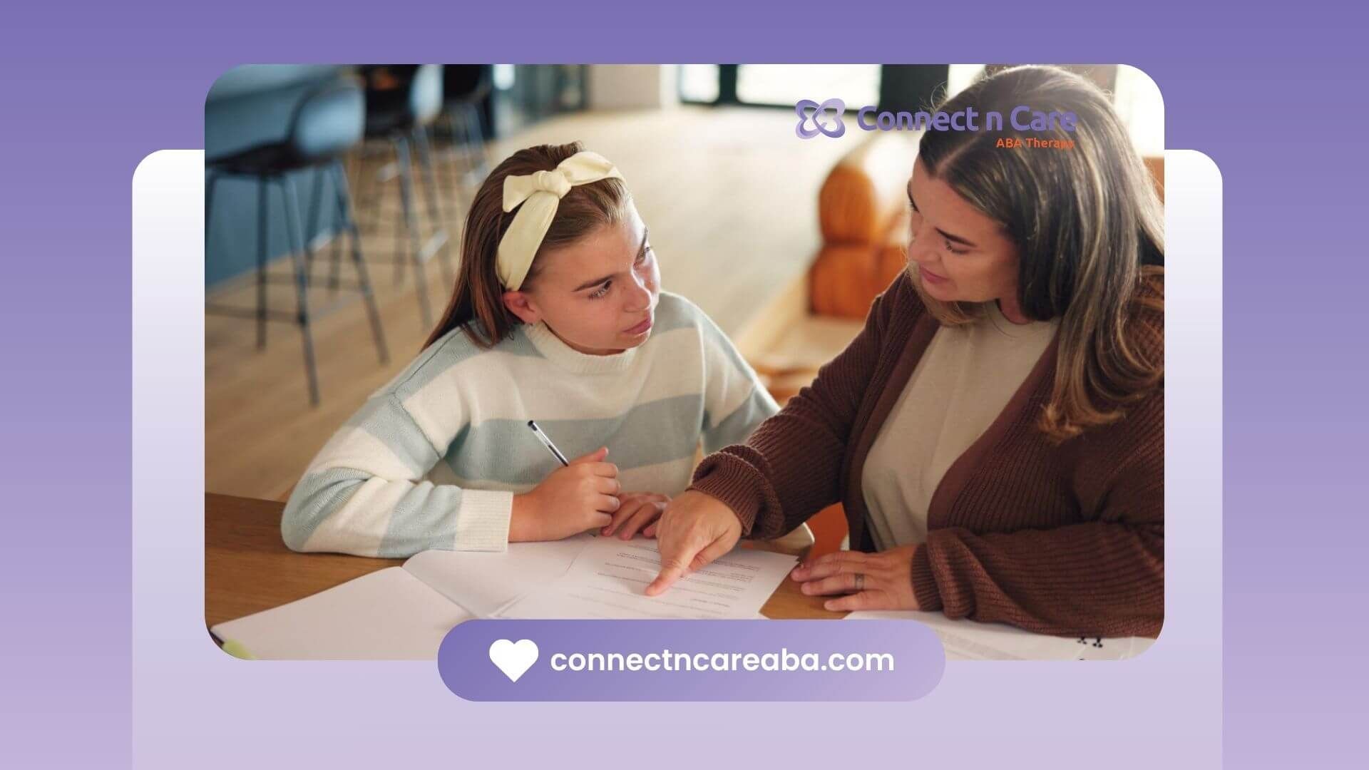 BCBA supporting teenage girl while reviewing schoolwork at home.