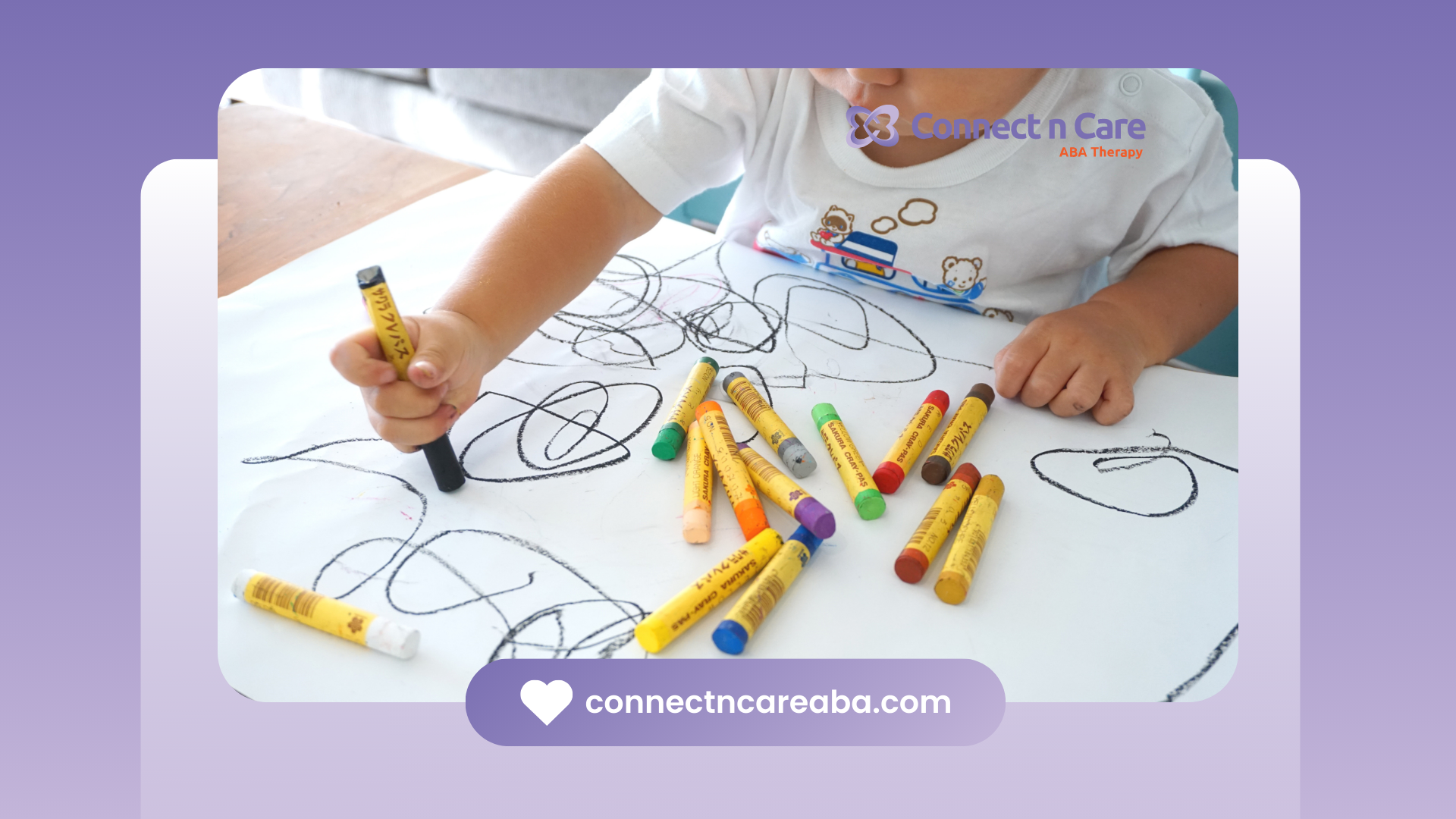 Child drawing with crayons on white paper.