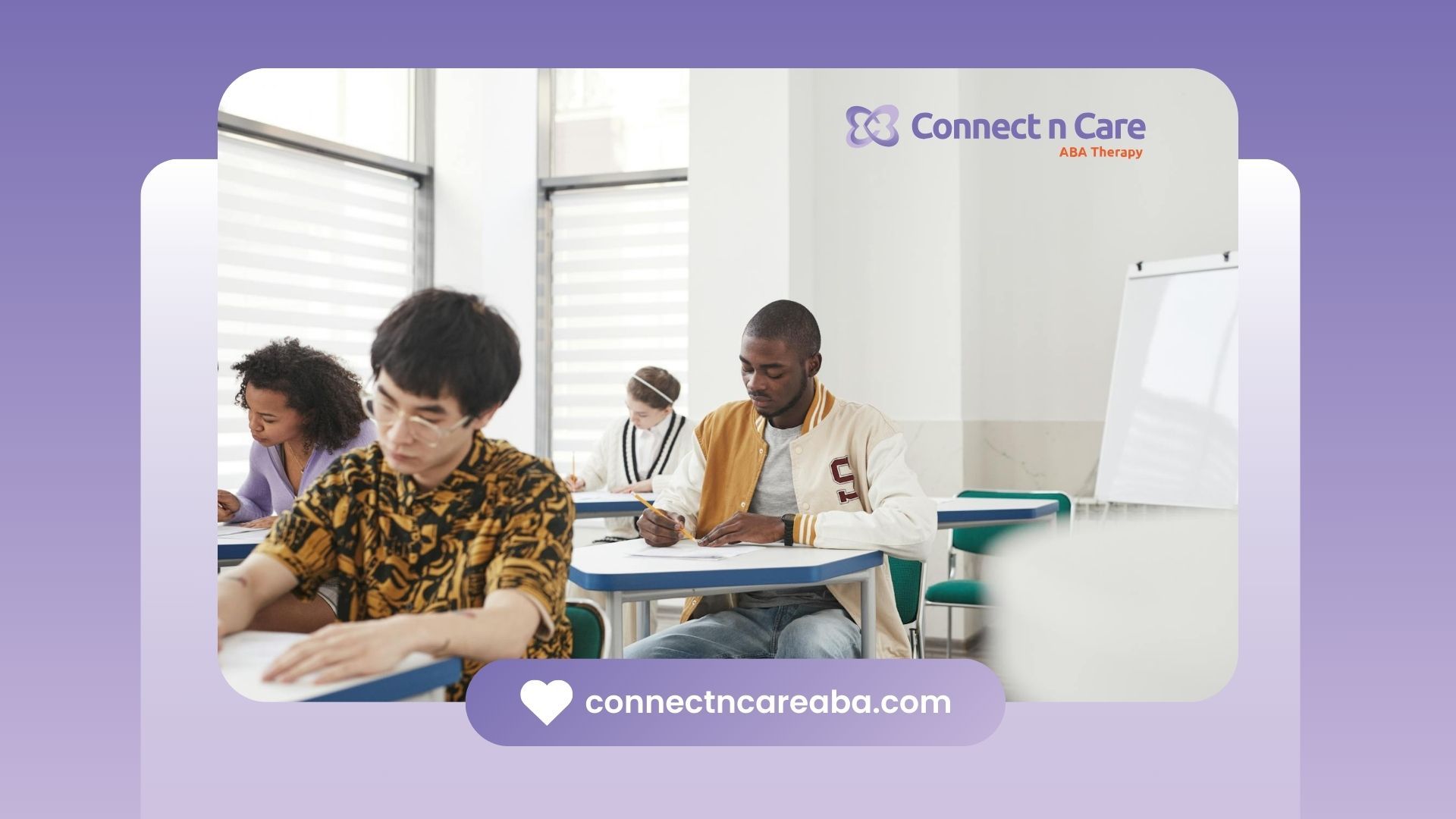 A diverse group of RBT students sits at desks in a classroom, focused on writing their exams in NC.