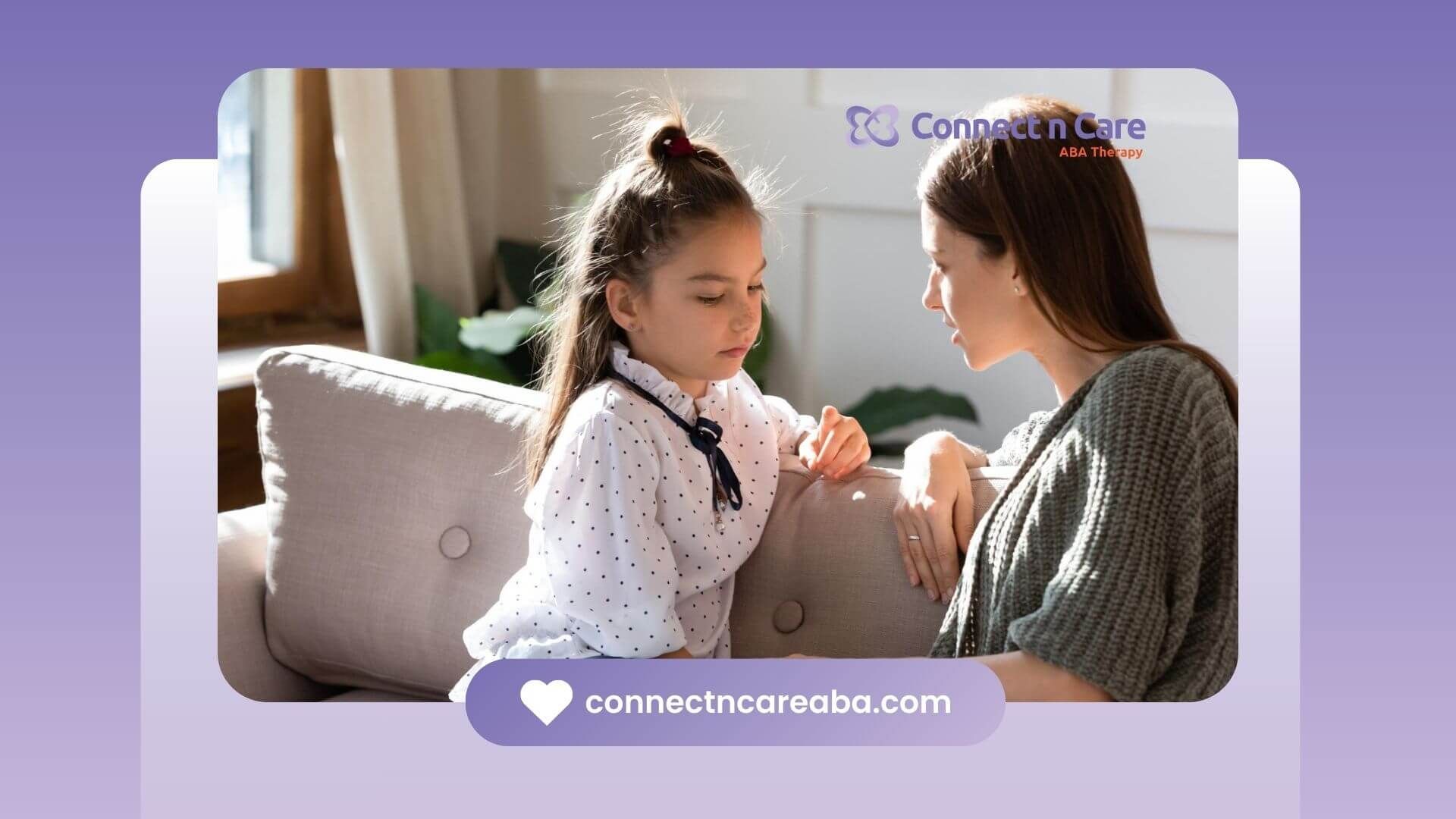 ABA therapist talking seriously with a young girl on a couch in ABA therapy.
