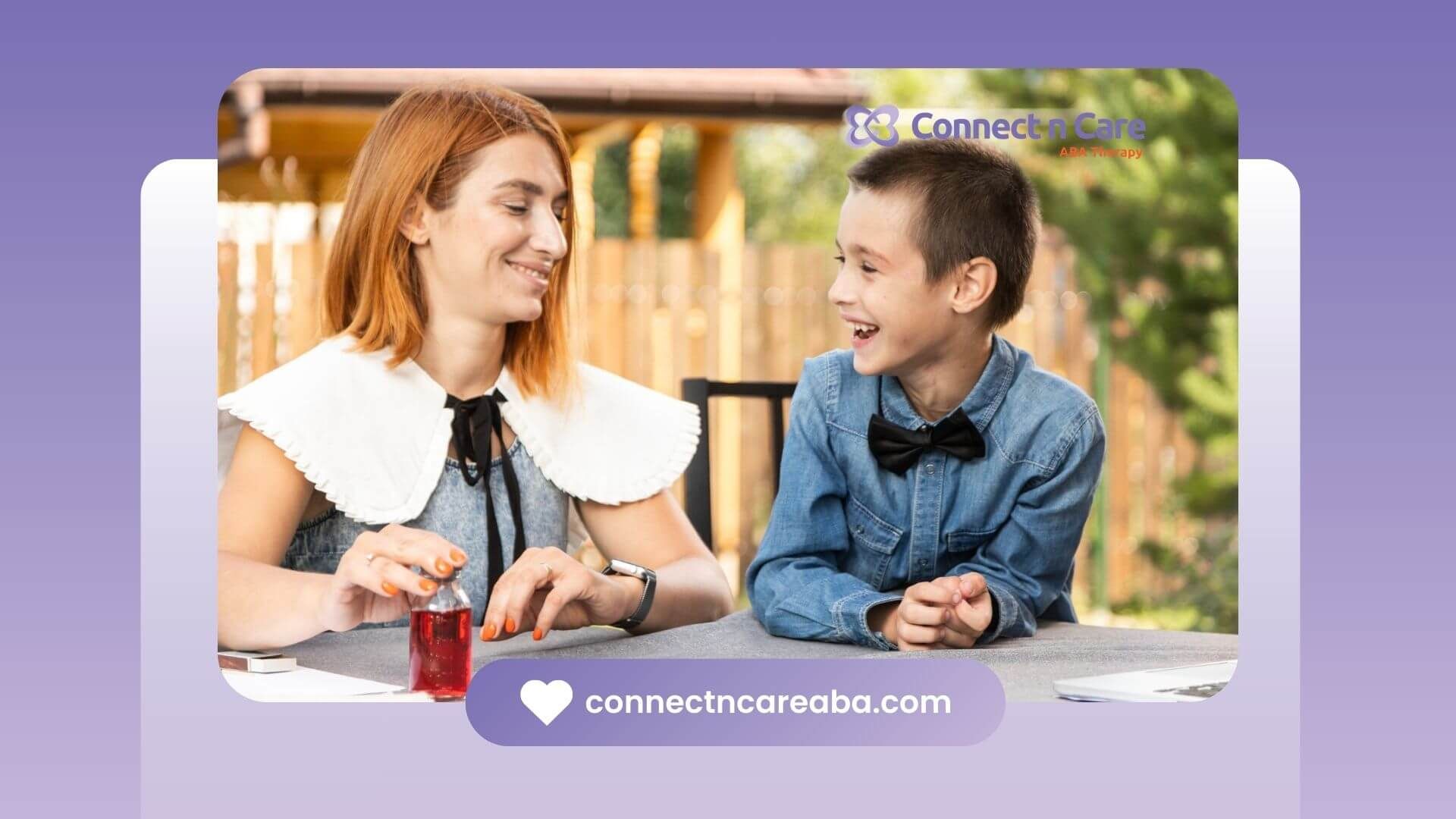 An ABA therapist smiling and talking with a laughing boy outdoors in ABA therapy.