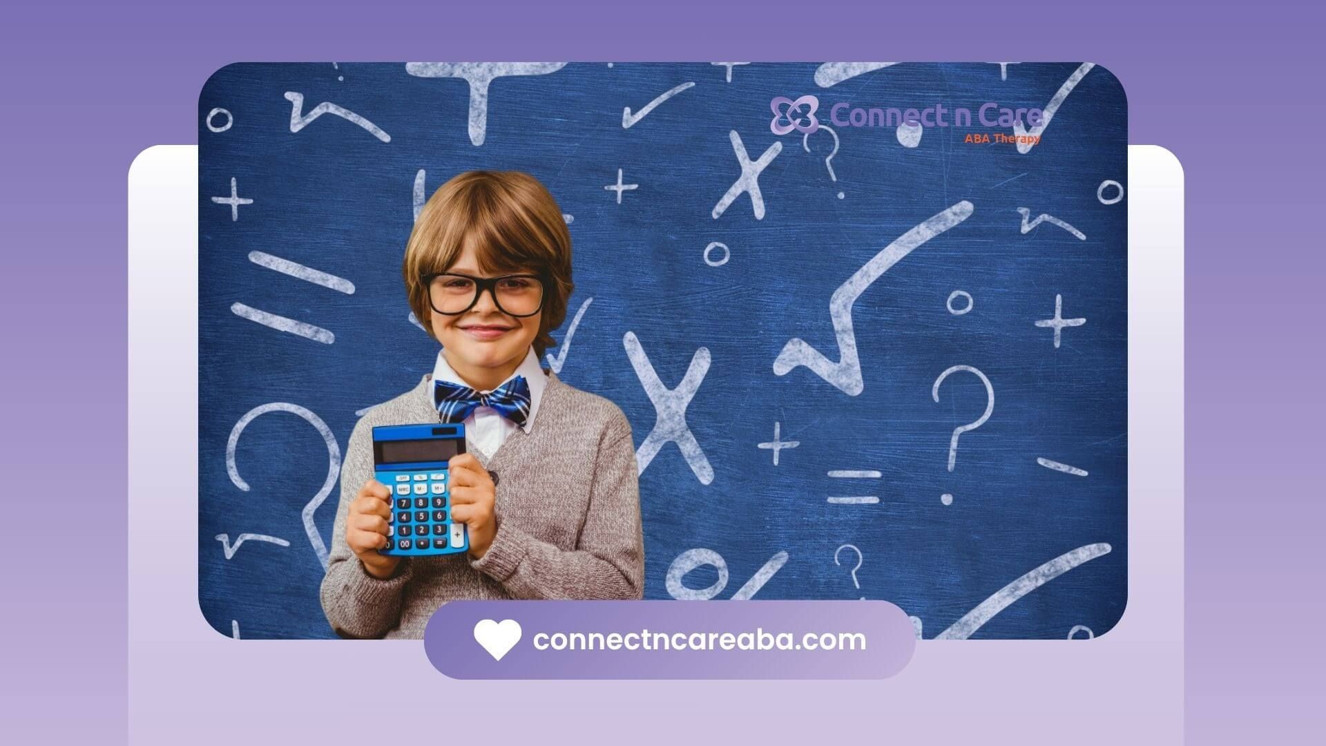 Smiling boy with autism holding a calculator in front of a chalkboard.