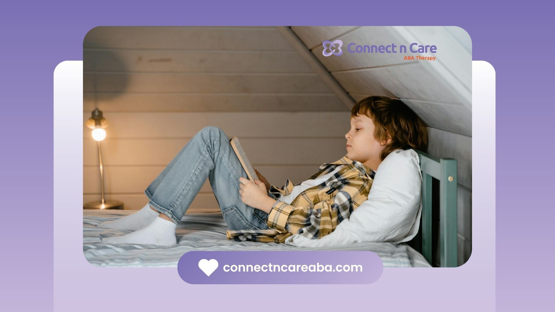 Autistic boy reading a book while lying on a bed in an attic room during in-home ABA therapy in NC.