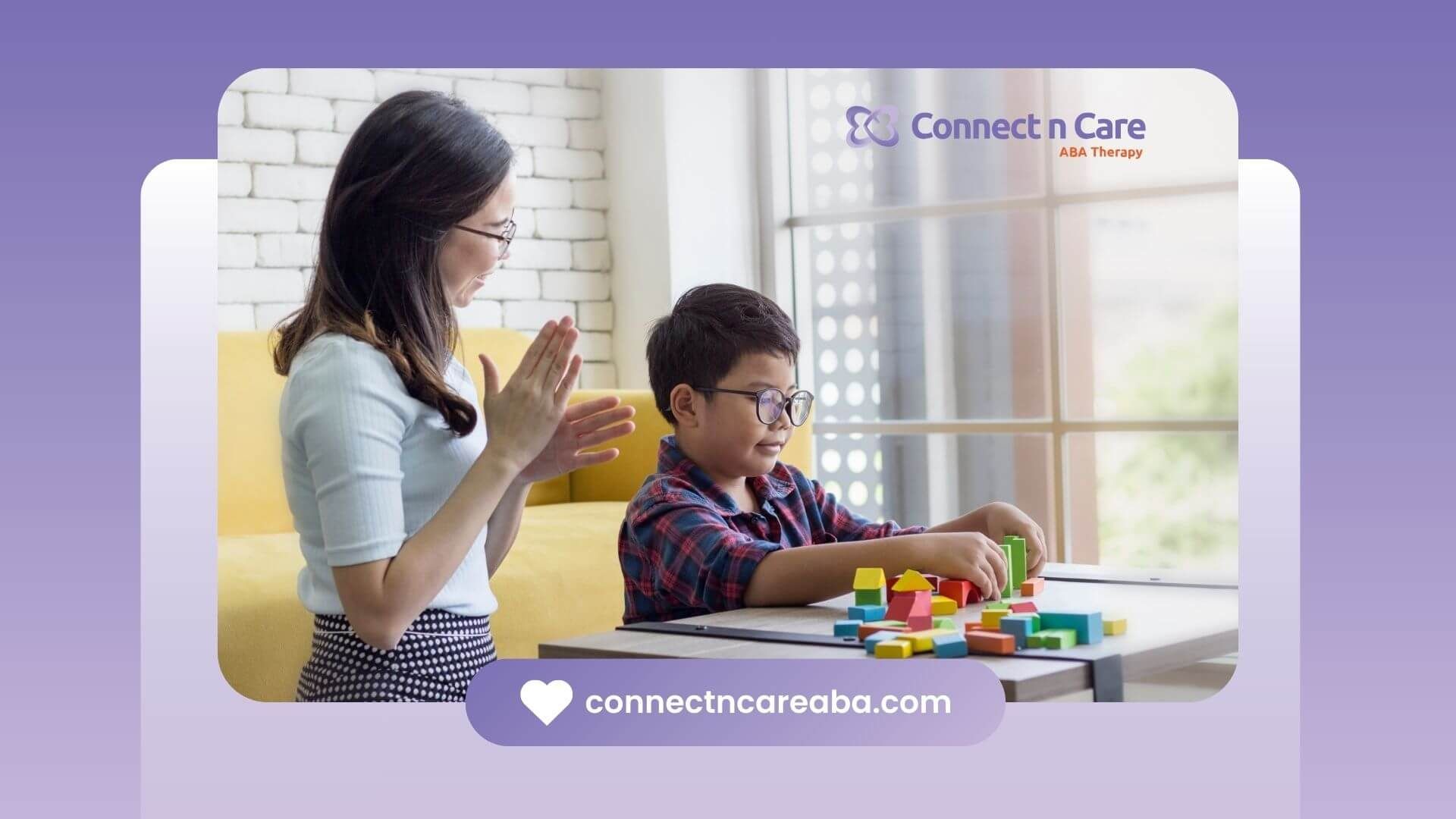 A female therapist watches her autistic child focus while building shapes using colorful blocks.