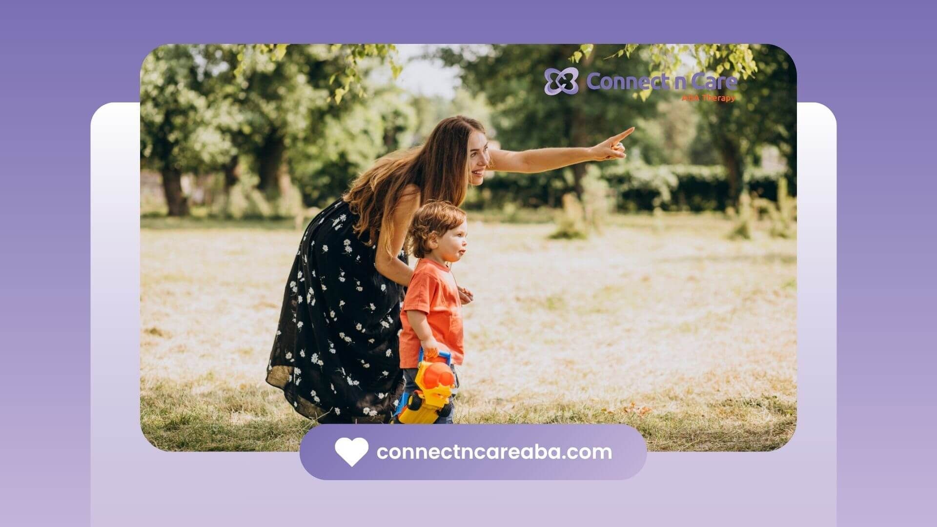 Therapist and child with autism playing outdoors, pointing at something in the distance.