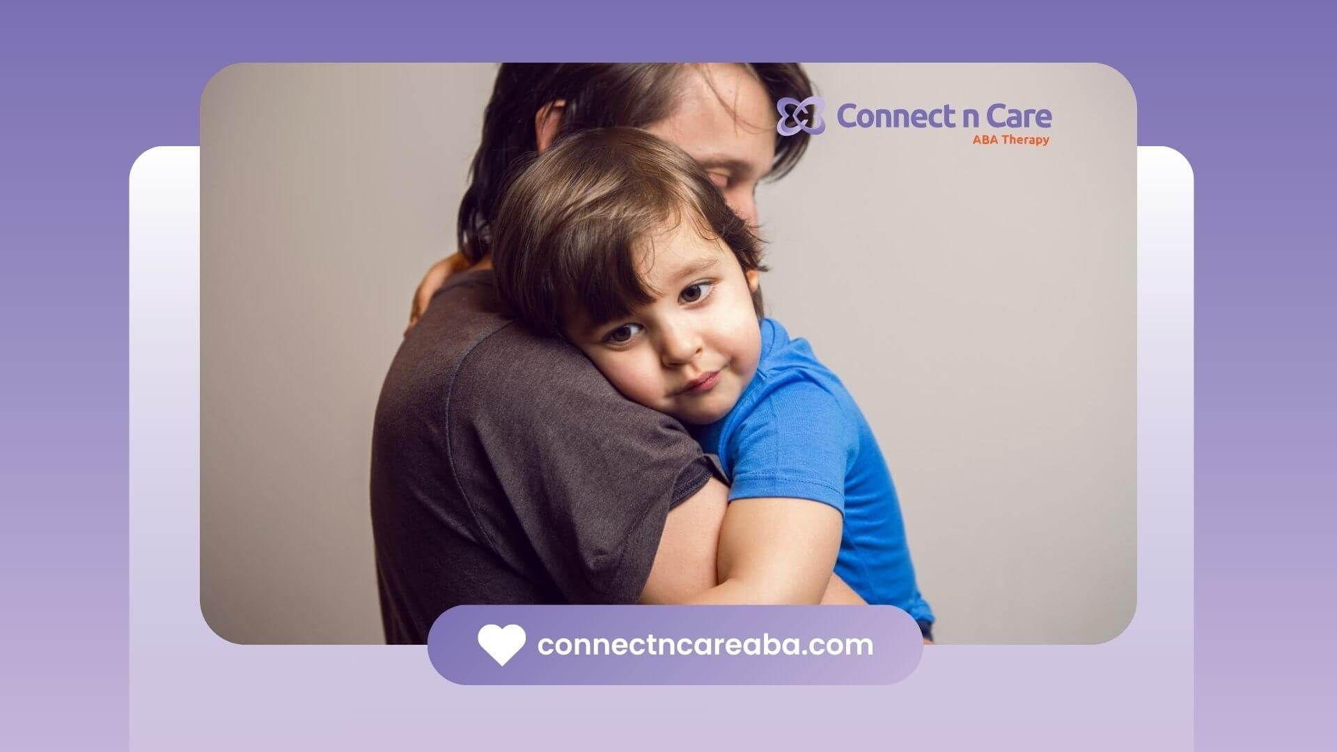 Young child with autism embracing a BCBA in a hug during ABA therapy.