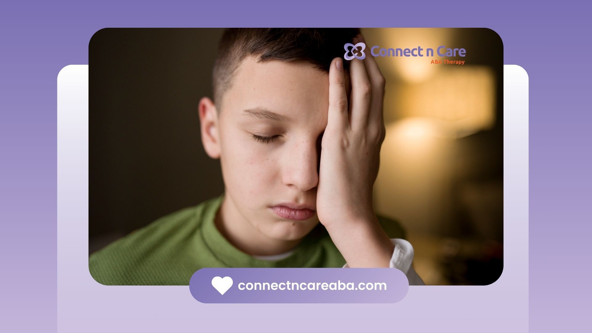 An autistic boy with his hand on his forehead.