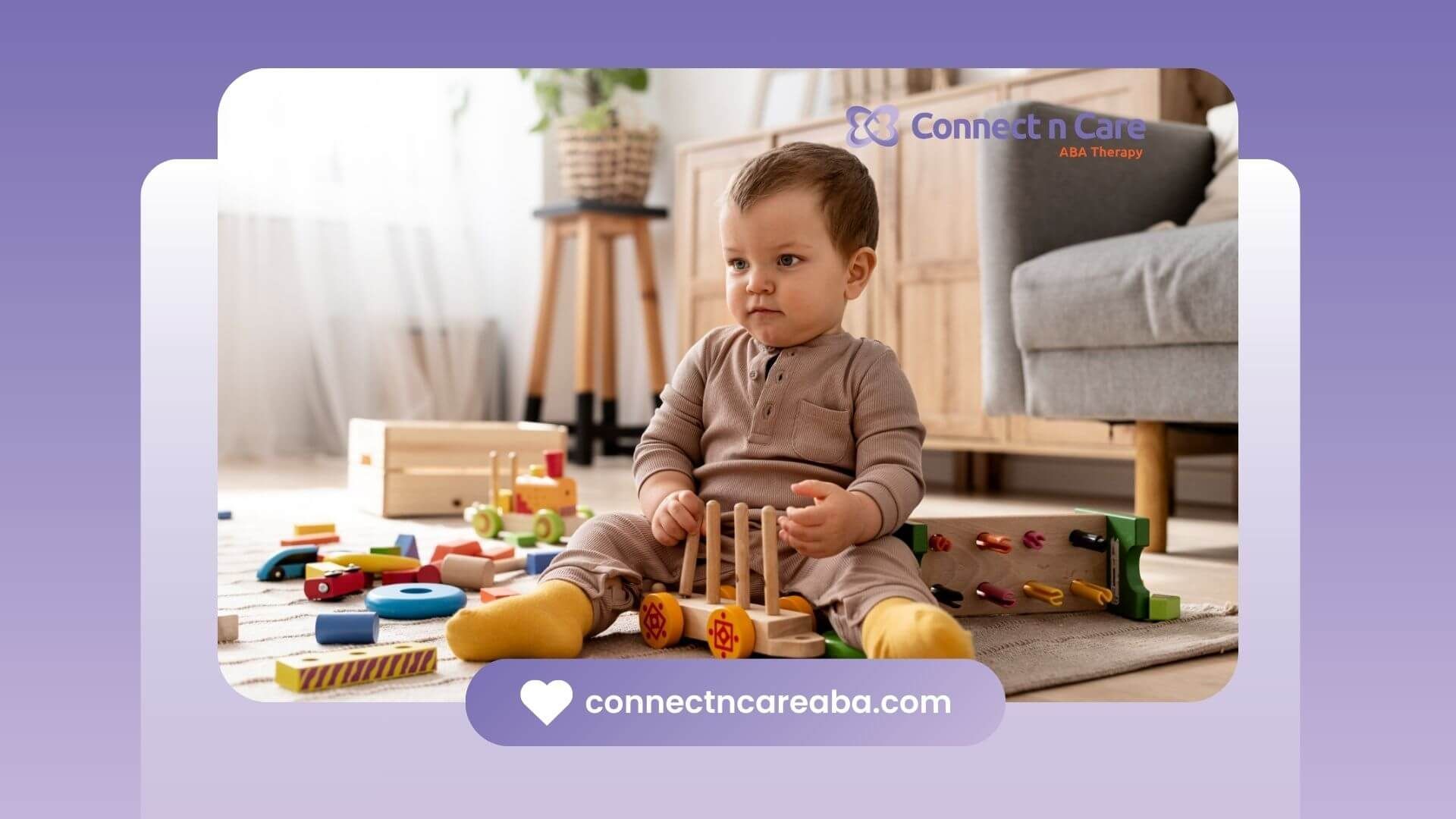 A toddler with autism sitting on a rug indoors in ABA therapy.