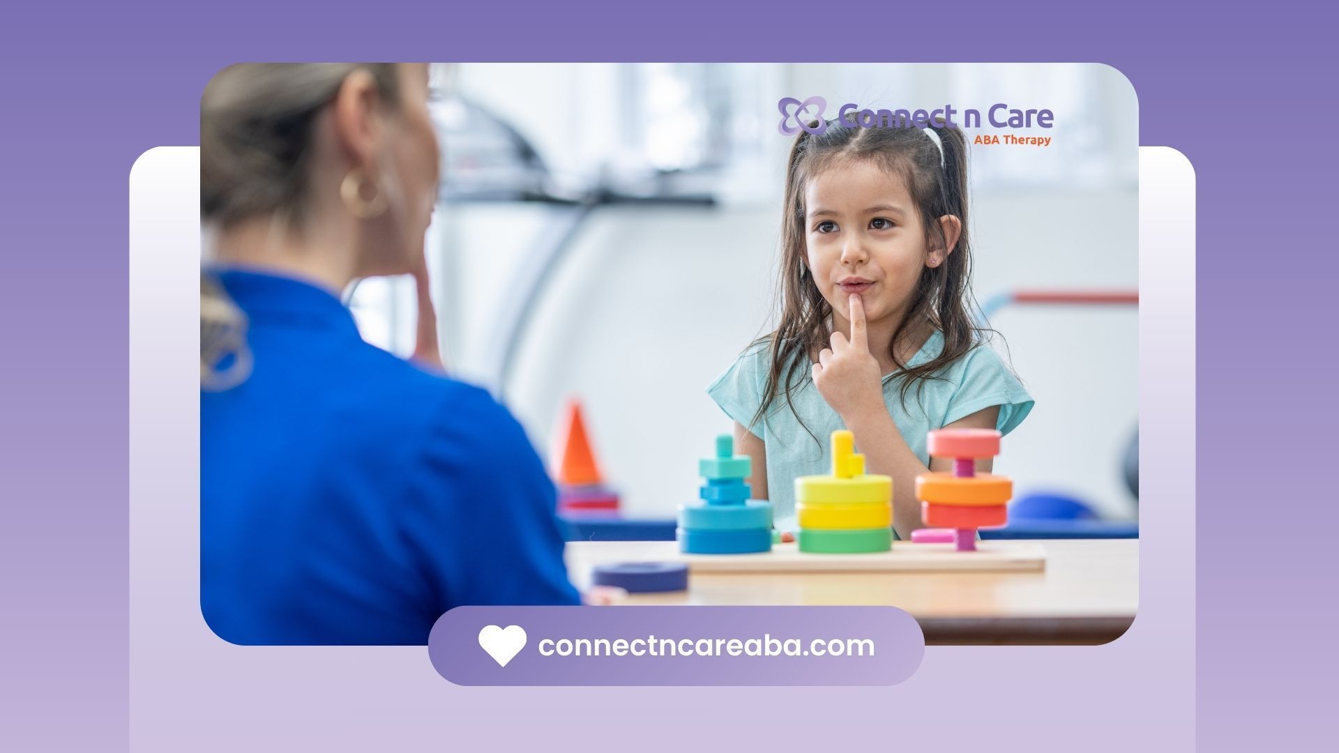 A young girl in therapy with a speech therapist, with colorful toys and purple background.